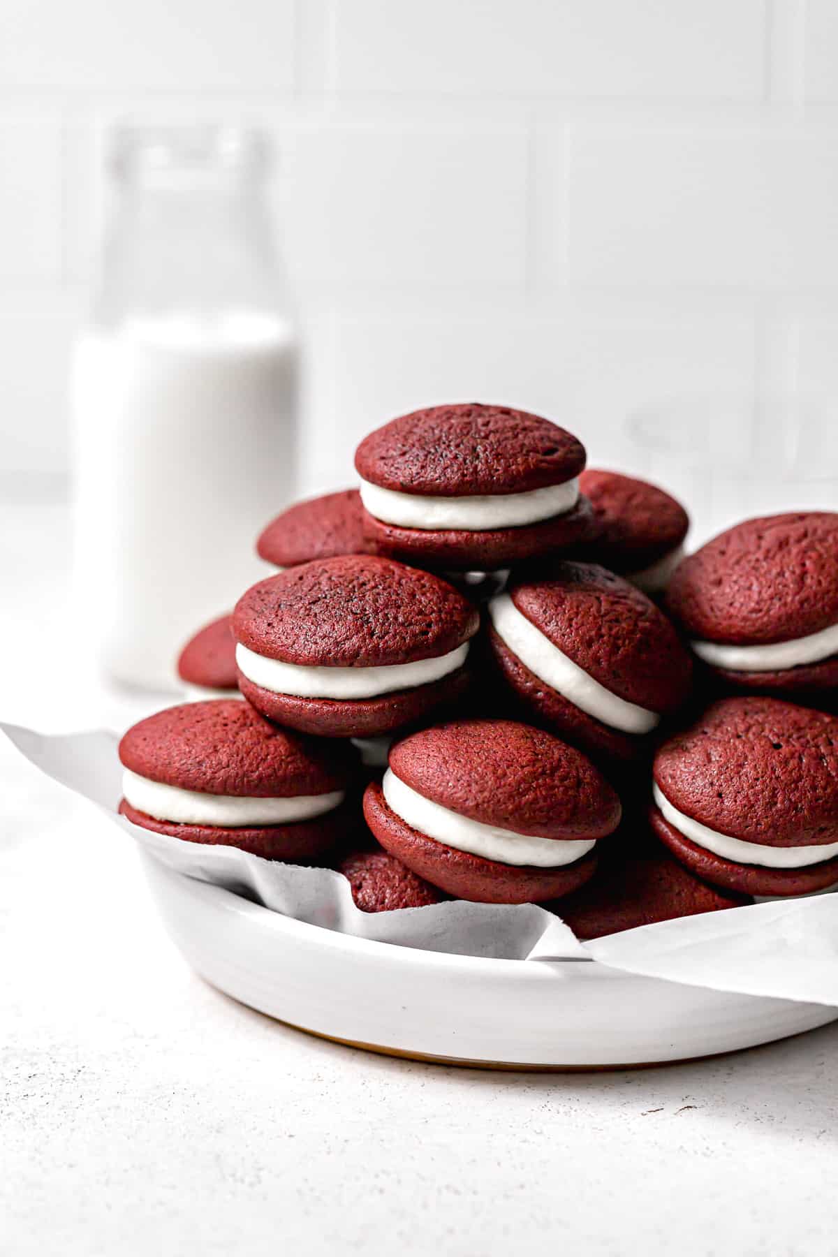 mini red velvet whoopie pies assembled and piled in bowl