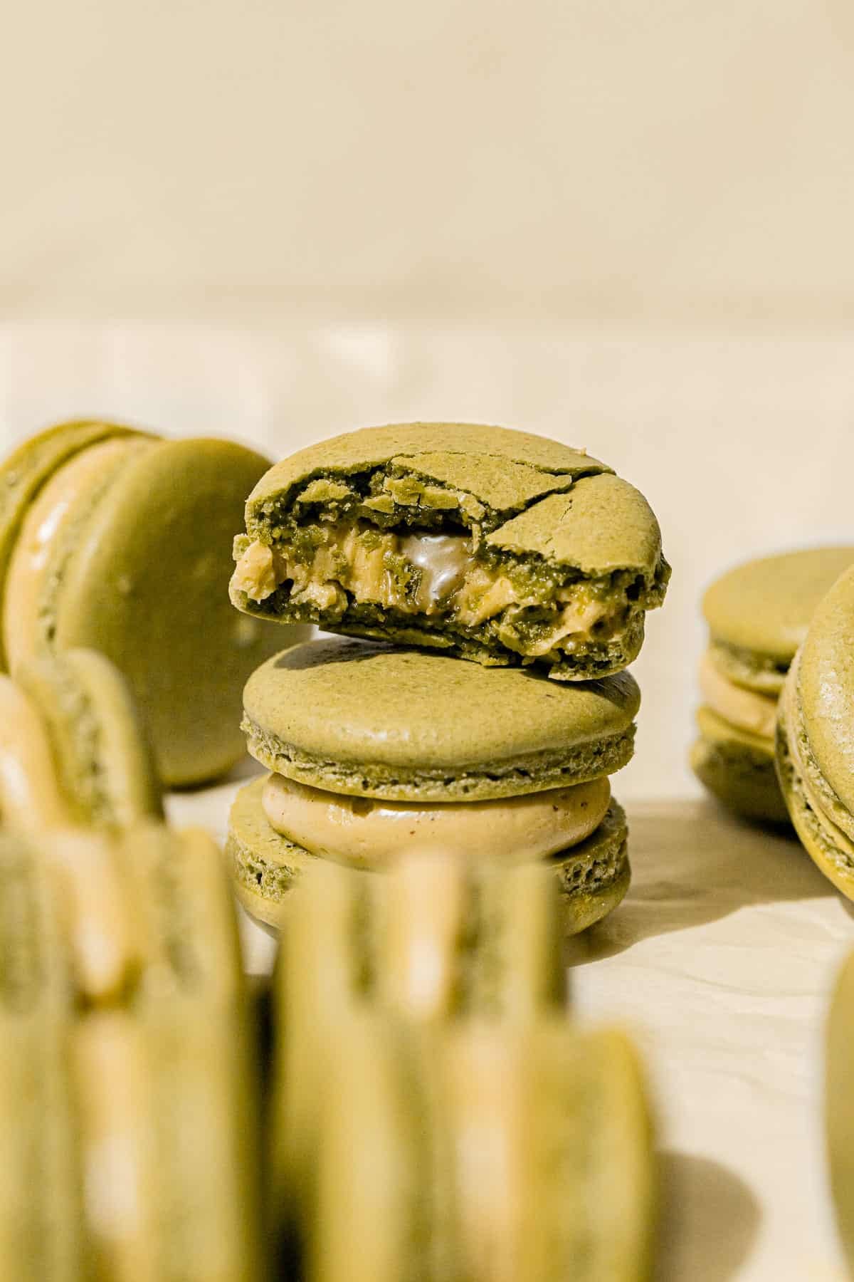 pistachio macarons stacked.