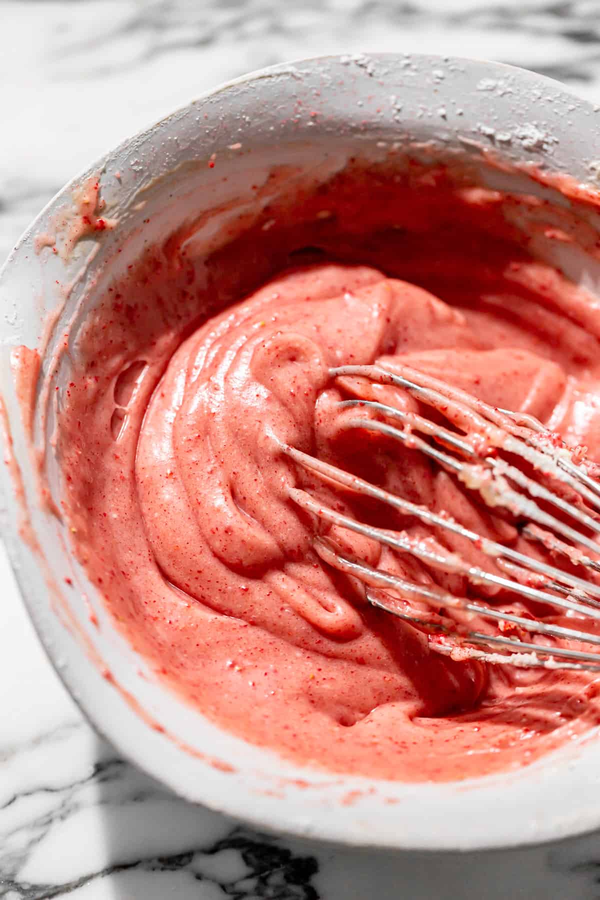 strawberry cream cheese icing in bowl. 