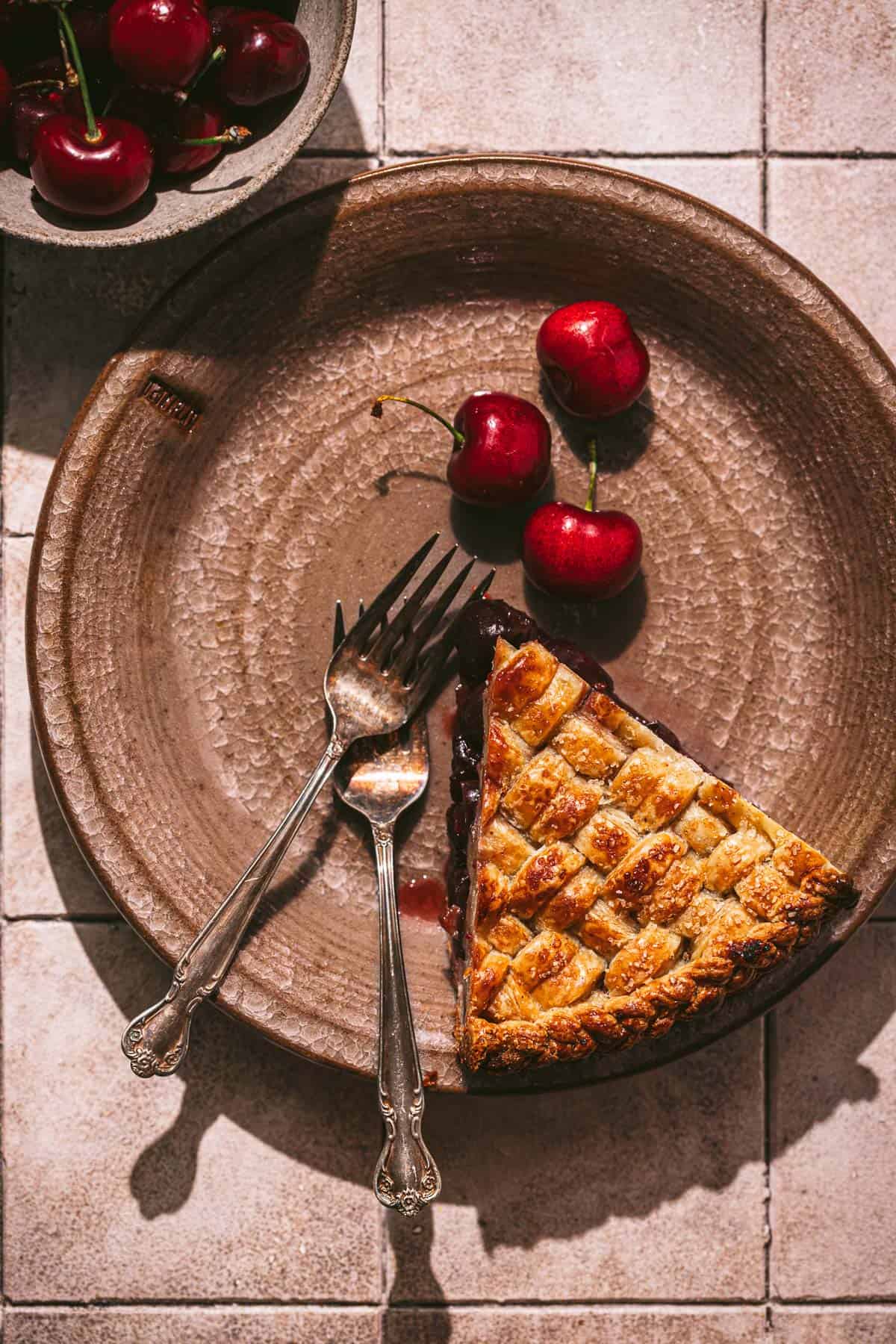 one piece of cherry pie on plate. 