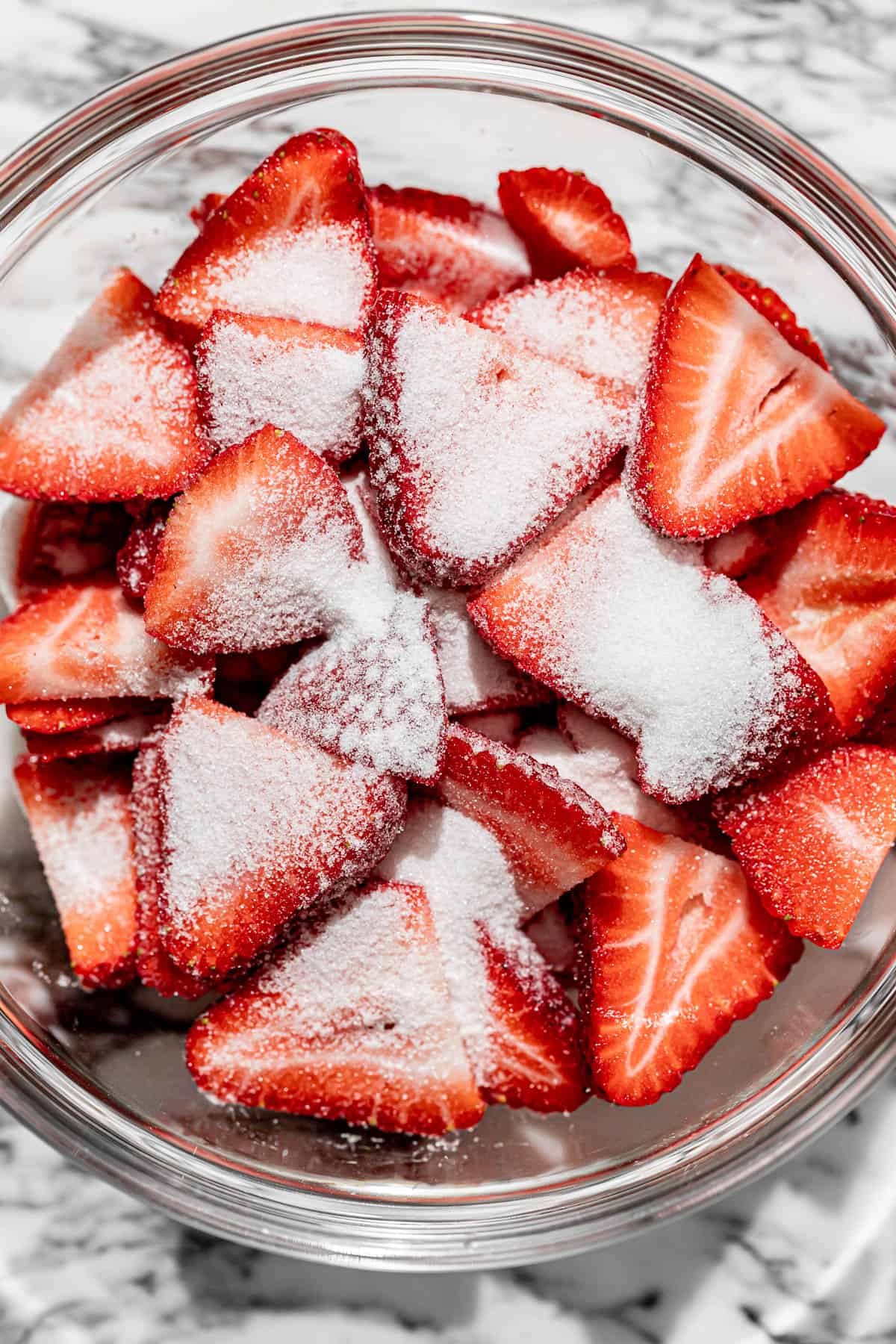 strawberries and sugar in bowl.