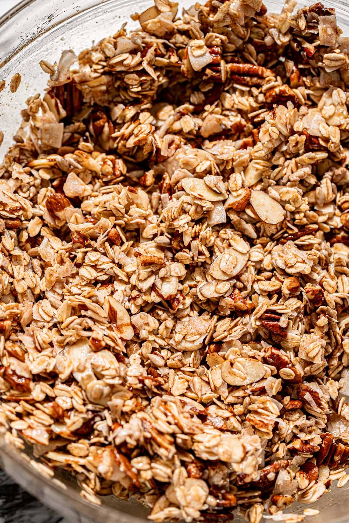 maple nut granola ingredients in a glass bowl.