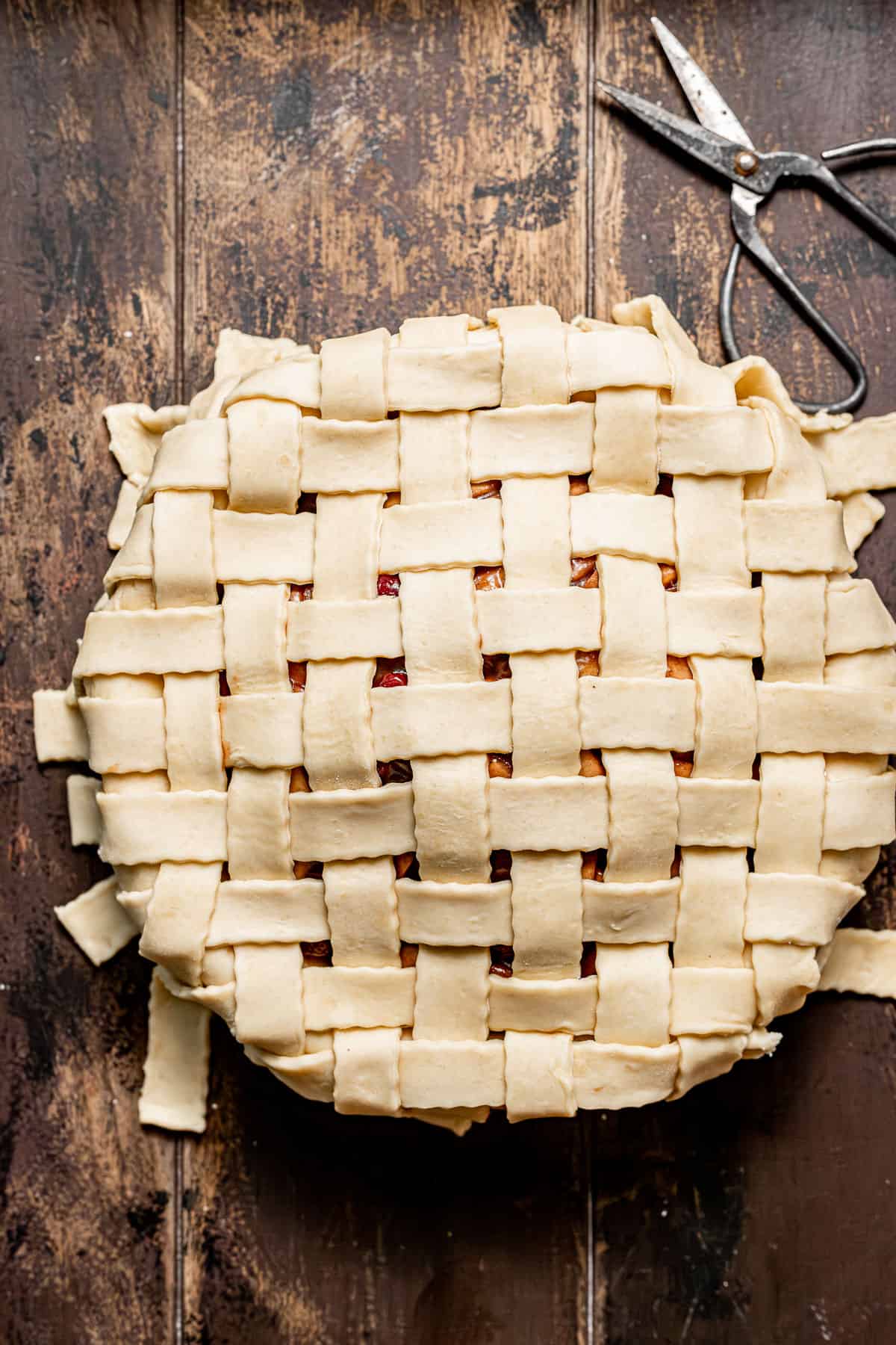 apple cranberry pie with lattice crust on top.