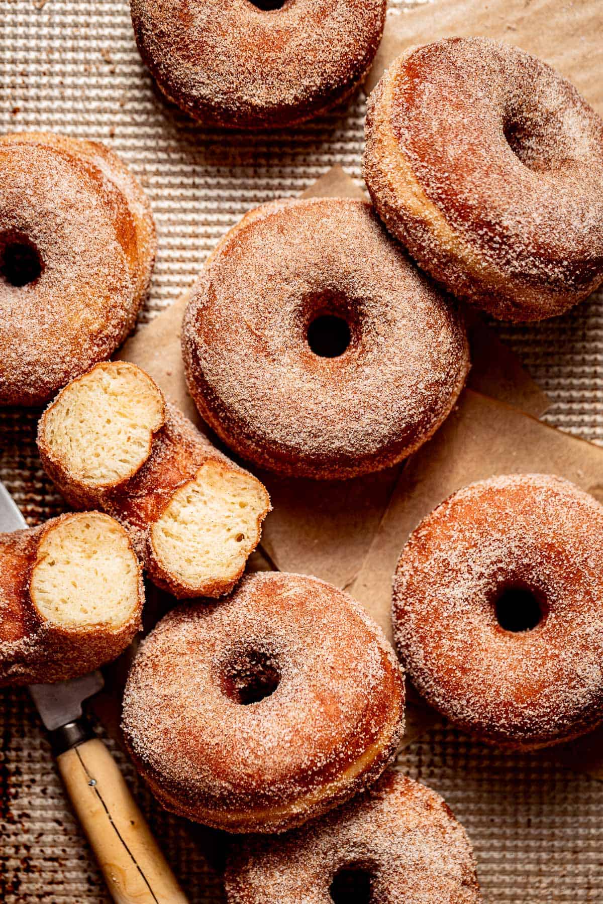 cinnamon sugar donuts on baking sheet.