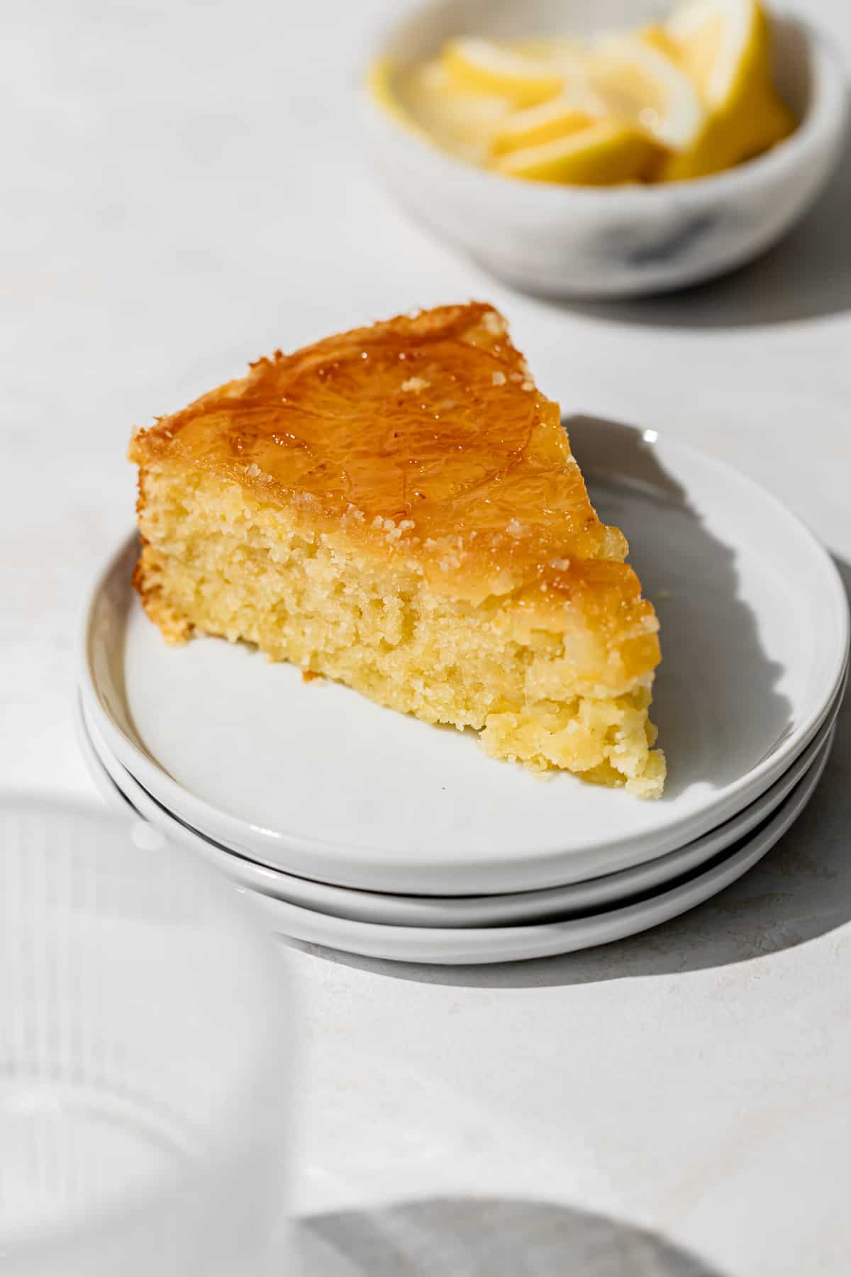 slice of lemon upside down cake on plate.