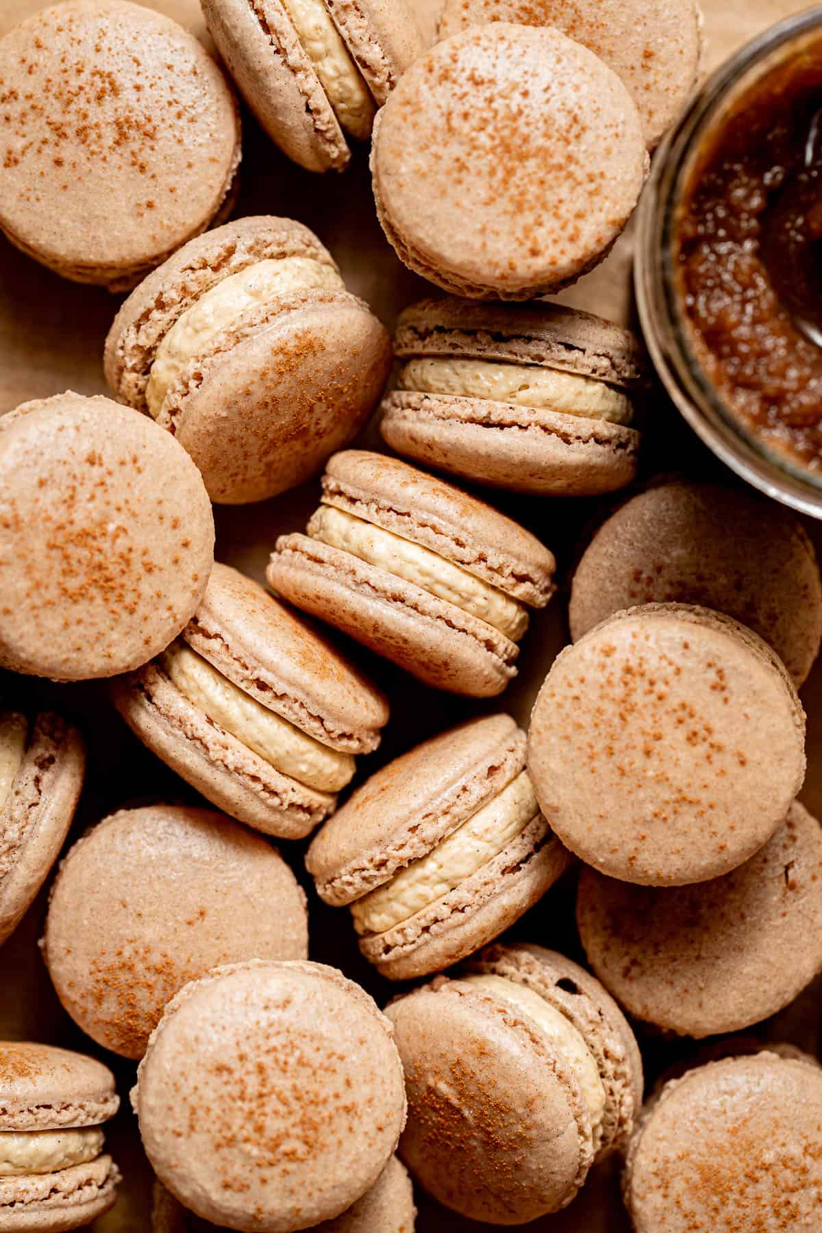 apple butter macarons in a pile.