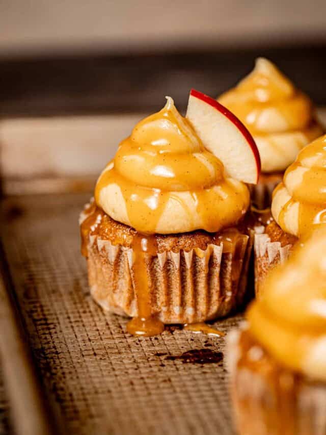 caramel apple cupcakes on baking sheet.