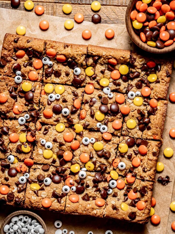monster cookie bars on parchment paper.