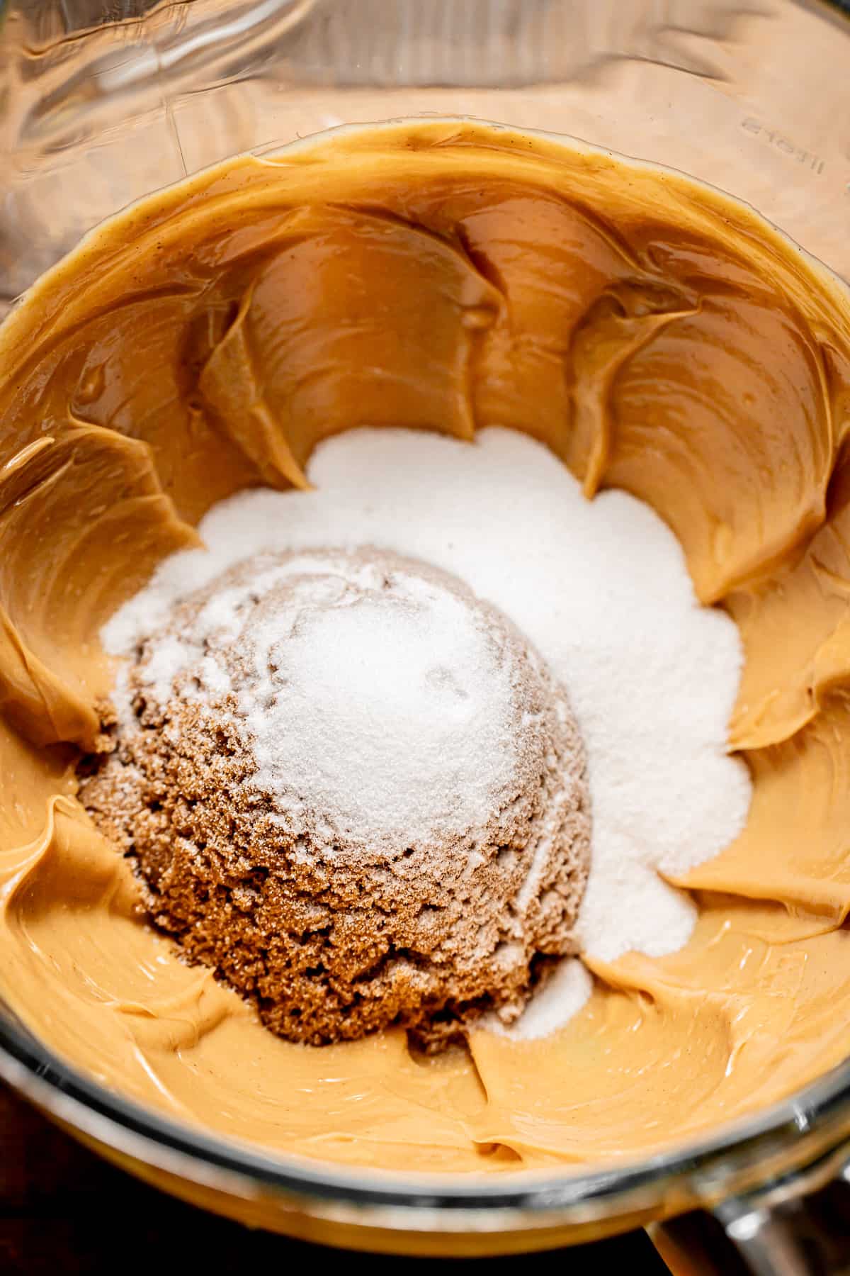 butter, peanut butter, and sugars creamed together in bowl.