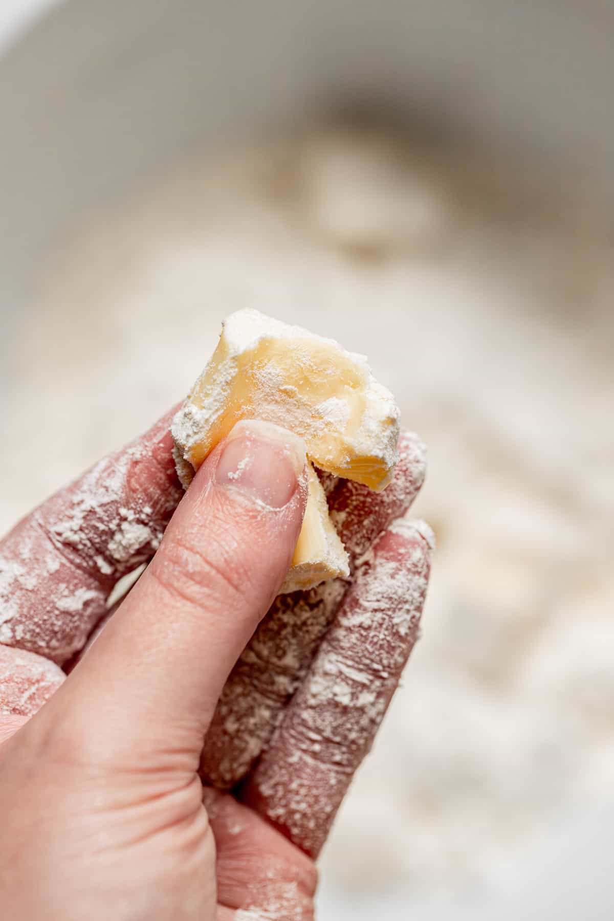 butter squished between fingers.