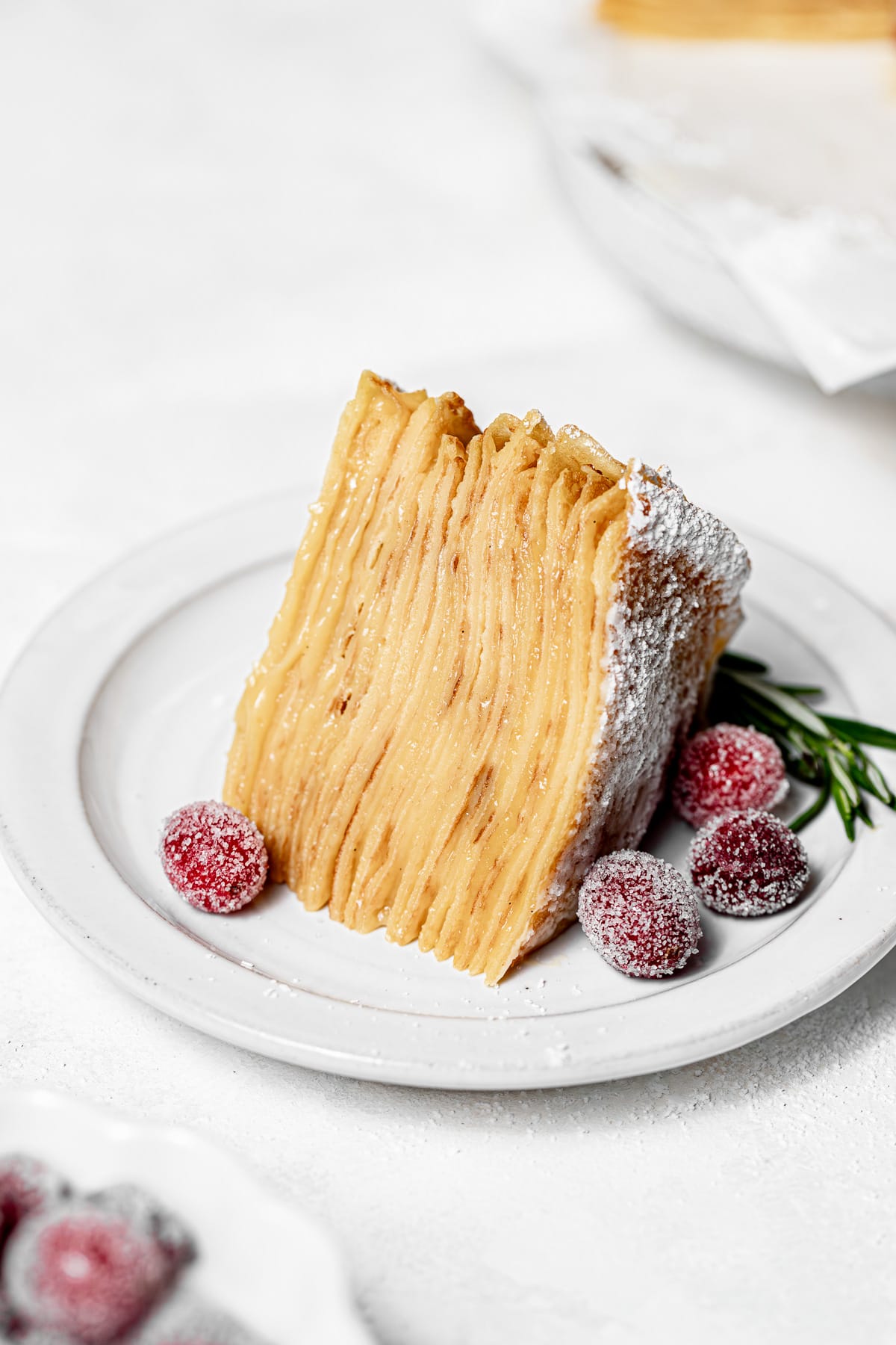 slice of crepe cake on a white plate.