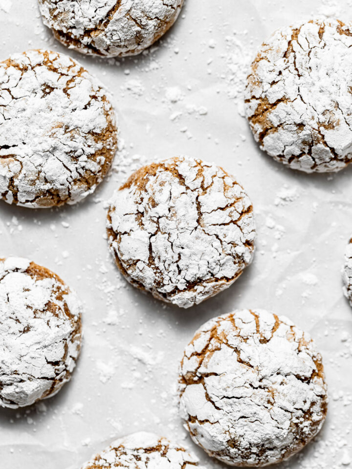 molasses crinkle cookies on parchment paper.