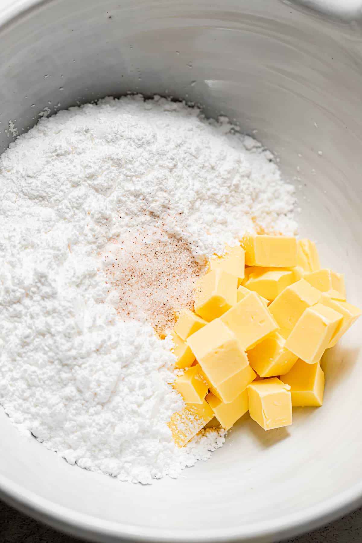 butter and sugars in white bowl.