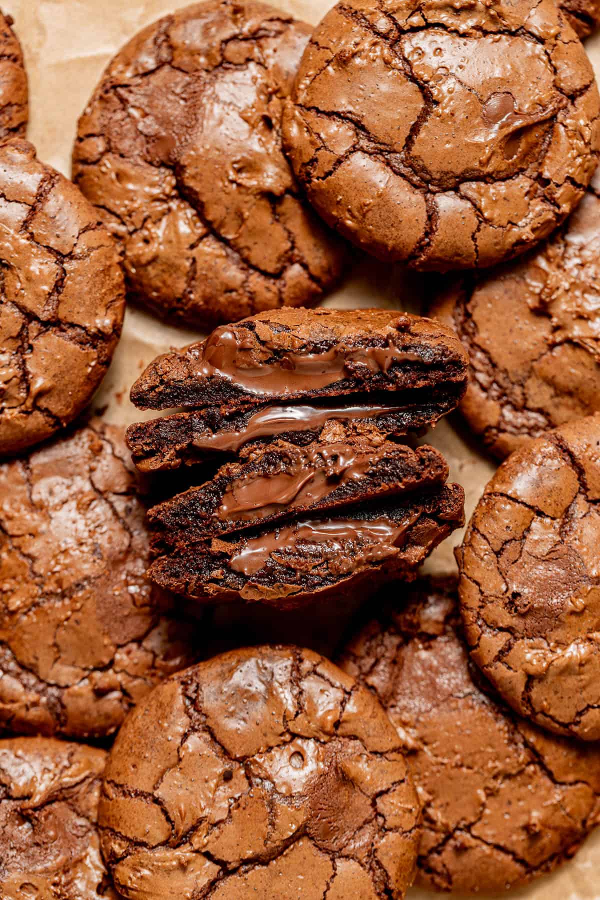 nutella cookies cut in half on parchment paper.
