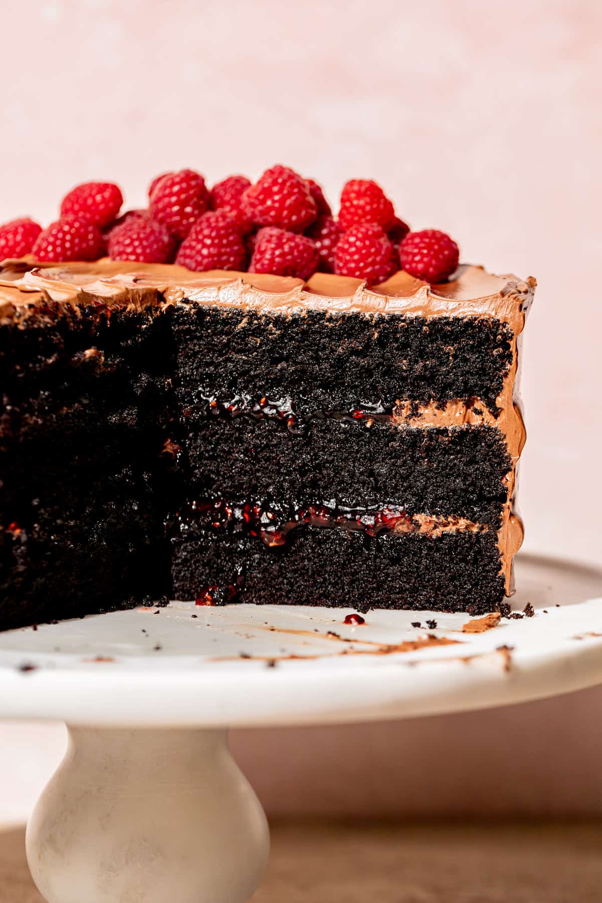 dark chocolate raspberry cake sliced so cake layers are visible.