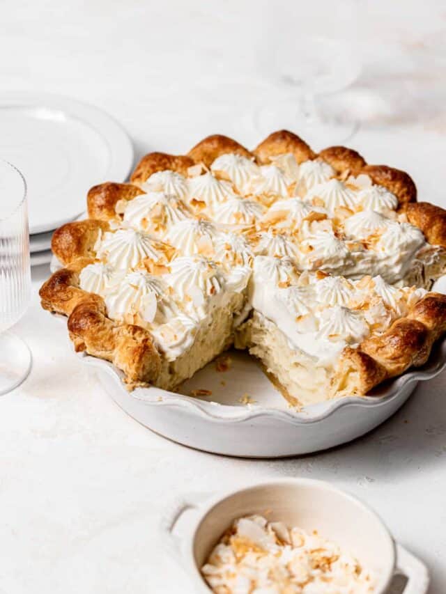 coconut cream pie in white pie dish.