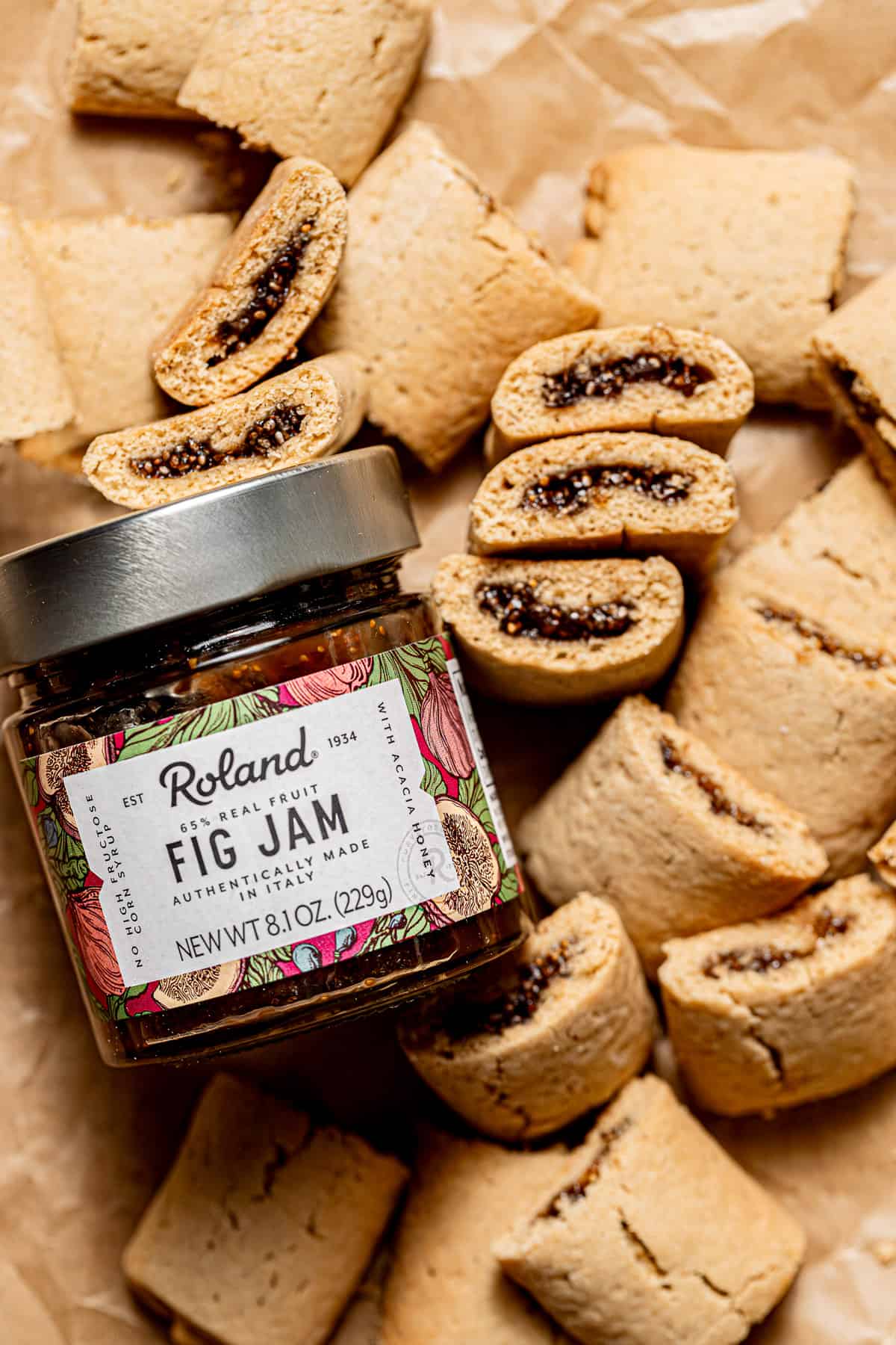 fig cookies next to jar of fig jam.