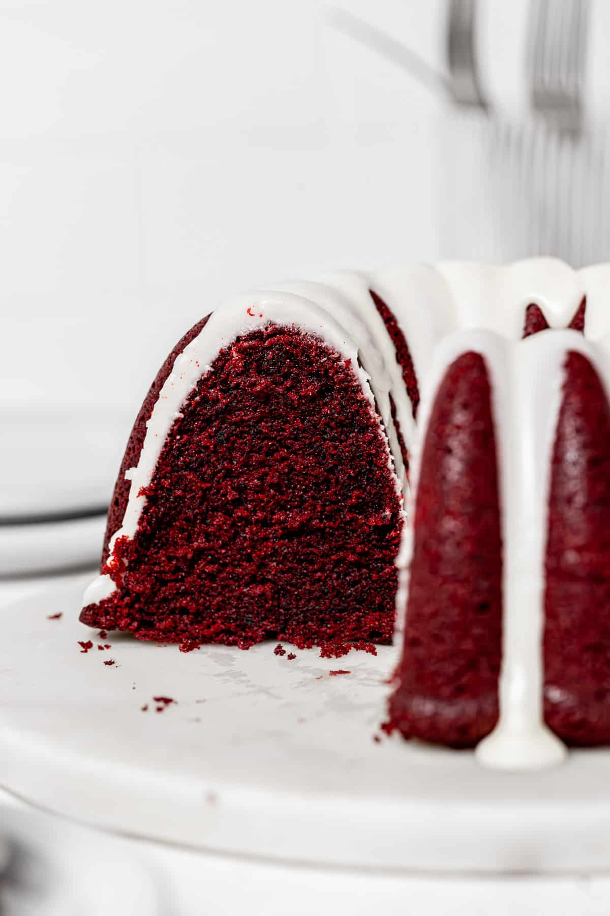 red velvet bundt cake cut to reveal inside texture.