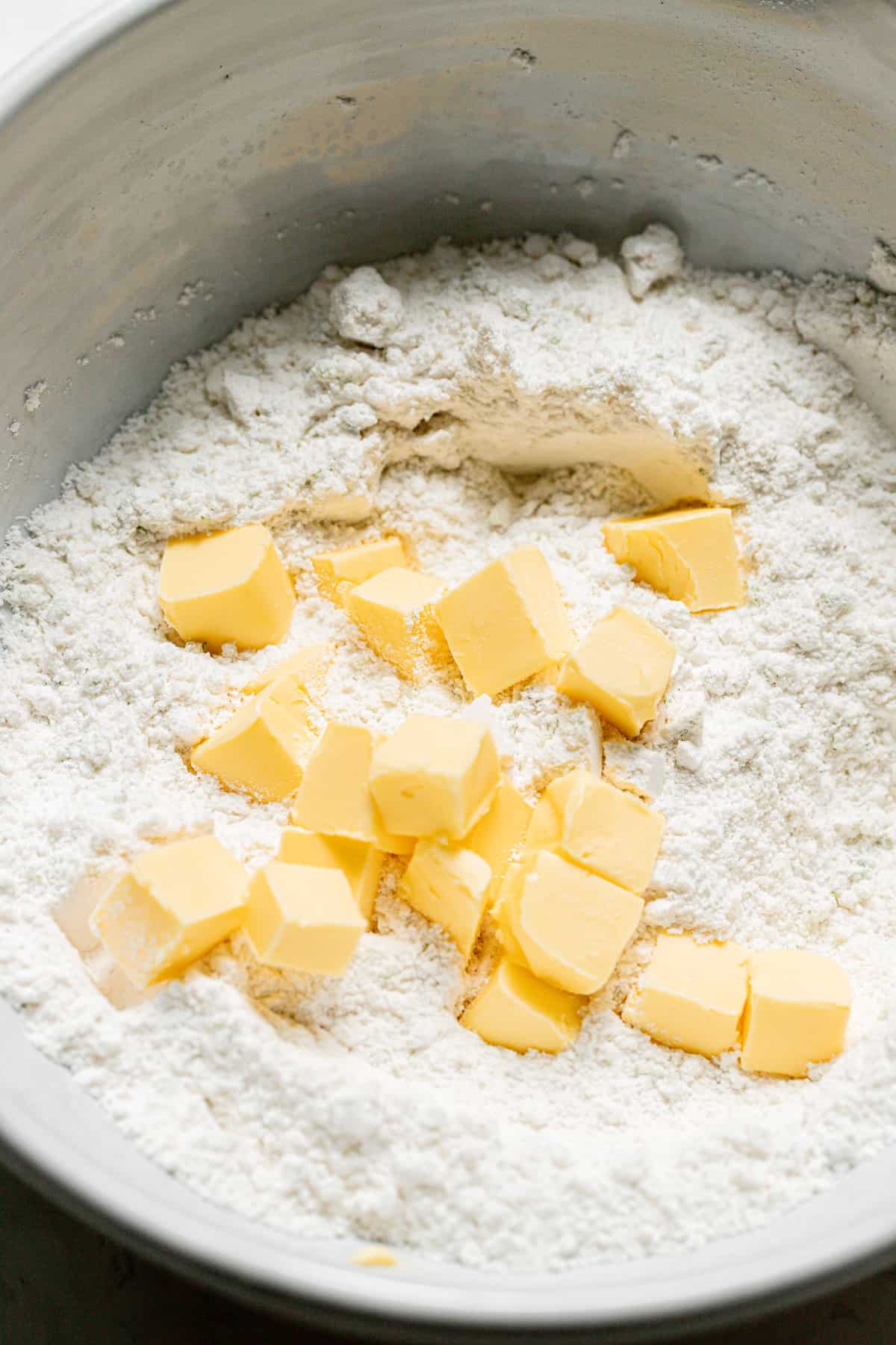 butter mixed into dry ingredients in bowl.