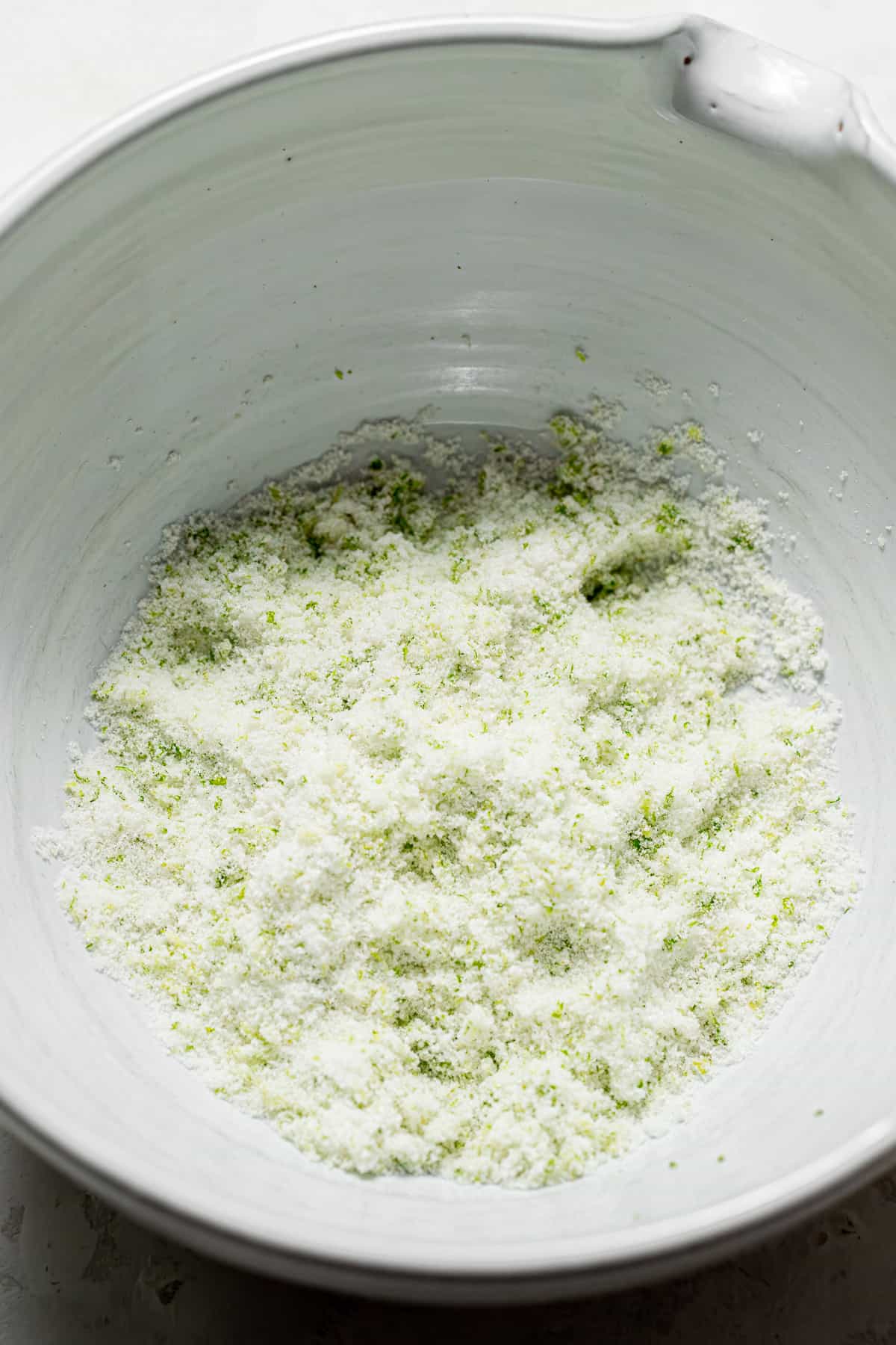 sugar and lime zest in bowl.