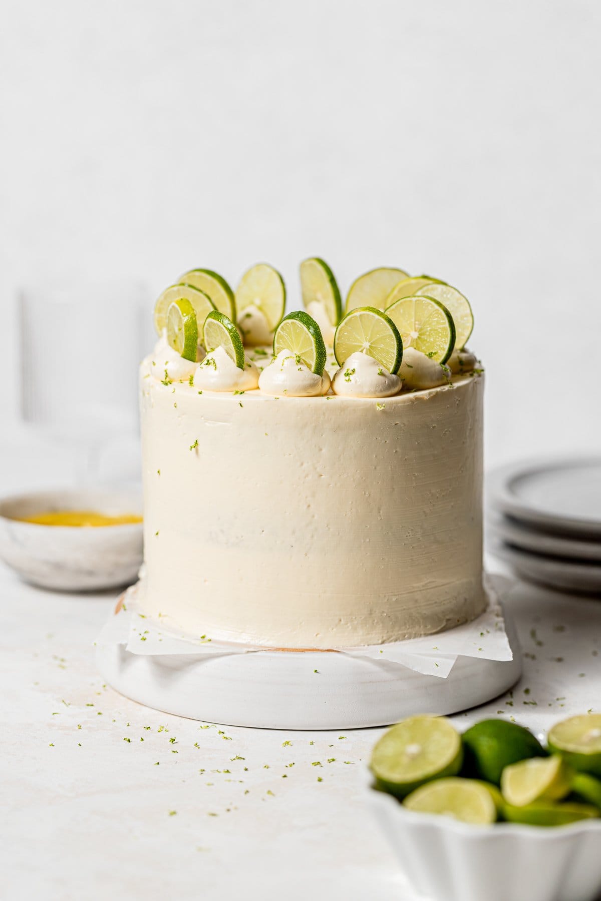 key lime cake on white plate with a large slice.