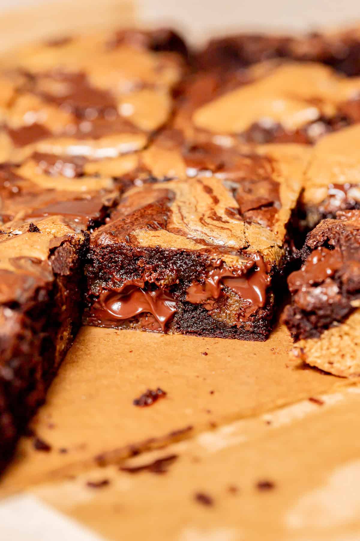 brownie blondie with melted chocolate chunks on parchment paper.