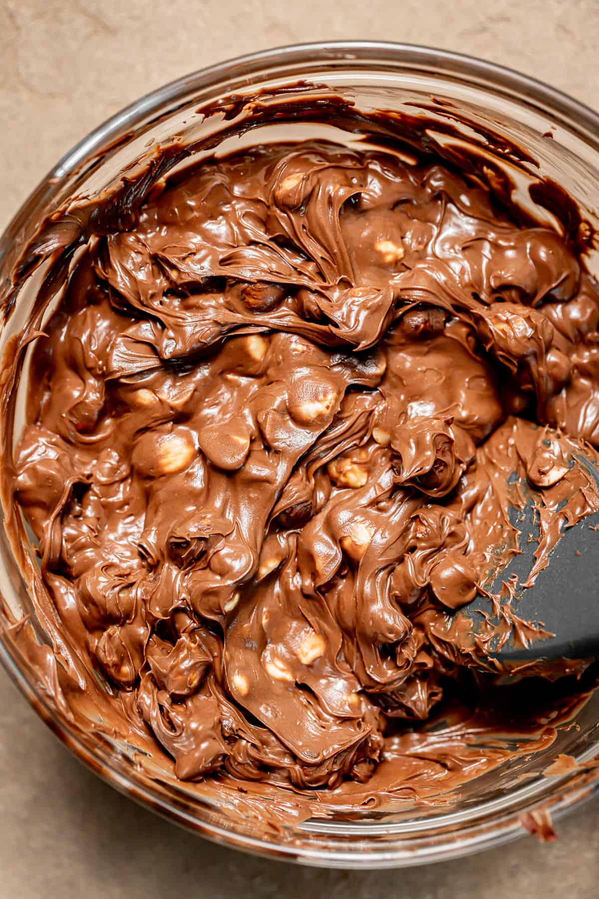 nutella and hazelnuts in bowl.