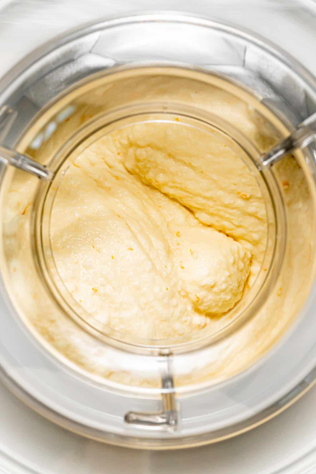 orange sherbet in ice cream maker.