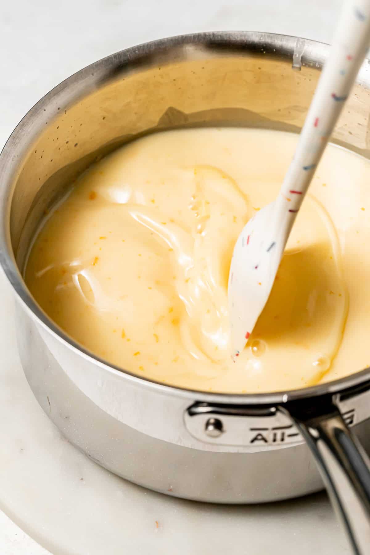 orange sherbet base in saucepan.