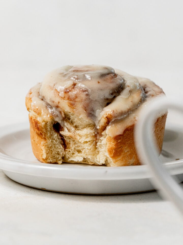 single serve cinnamon roll on plate.