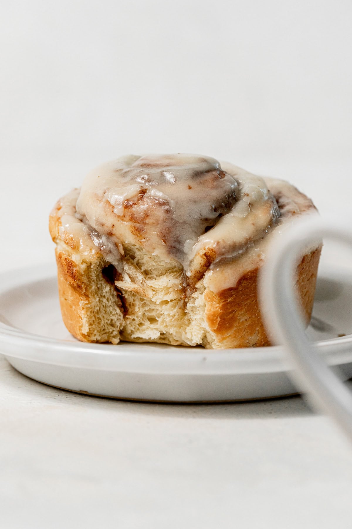 single serve cinnamon roll on plate.