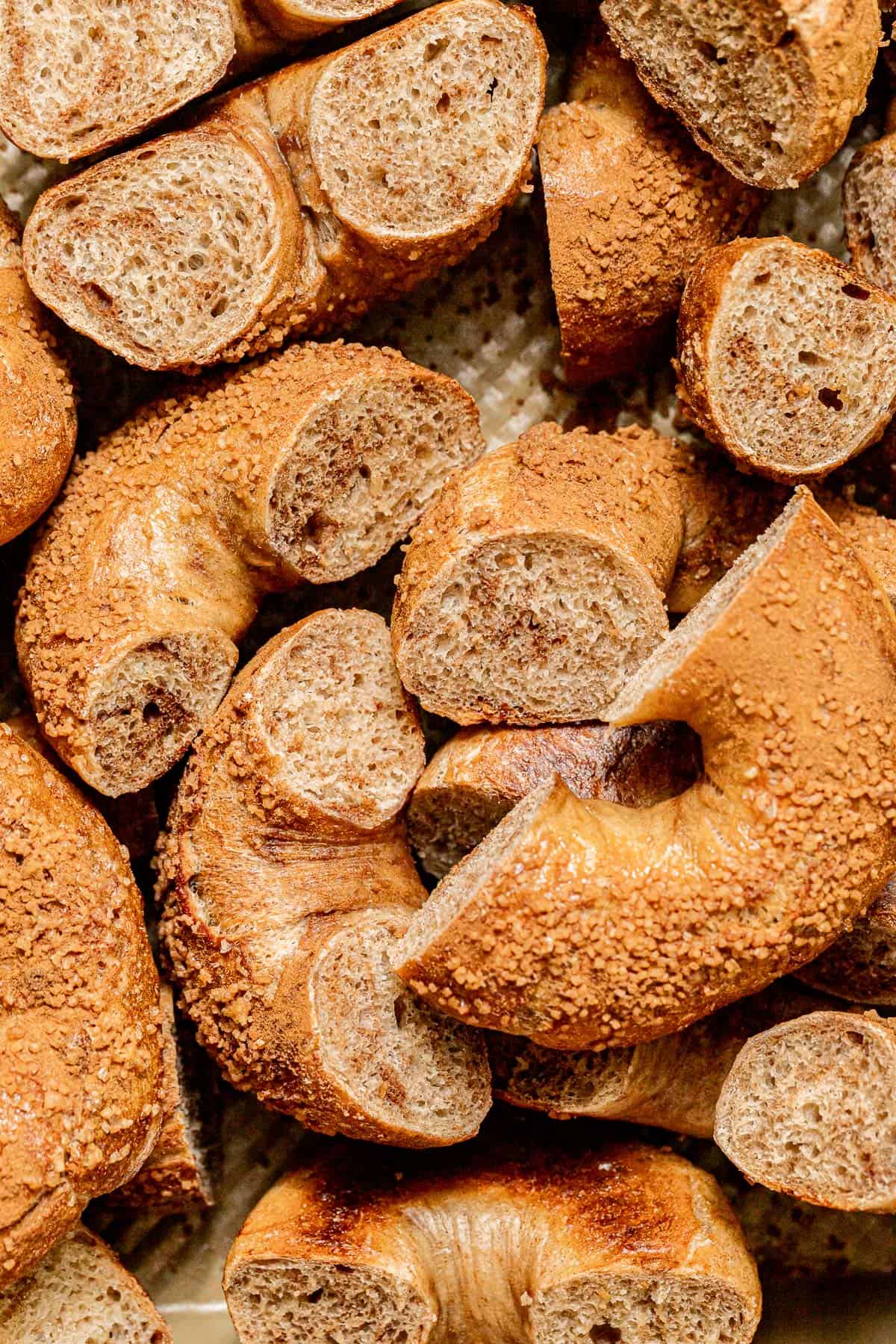 Cinnamon Swirl Bagel halves on baking sheet.