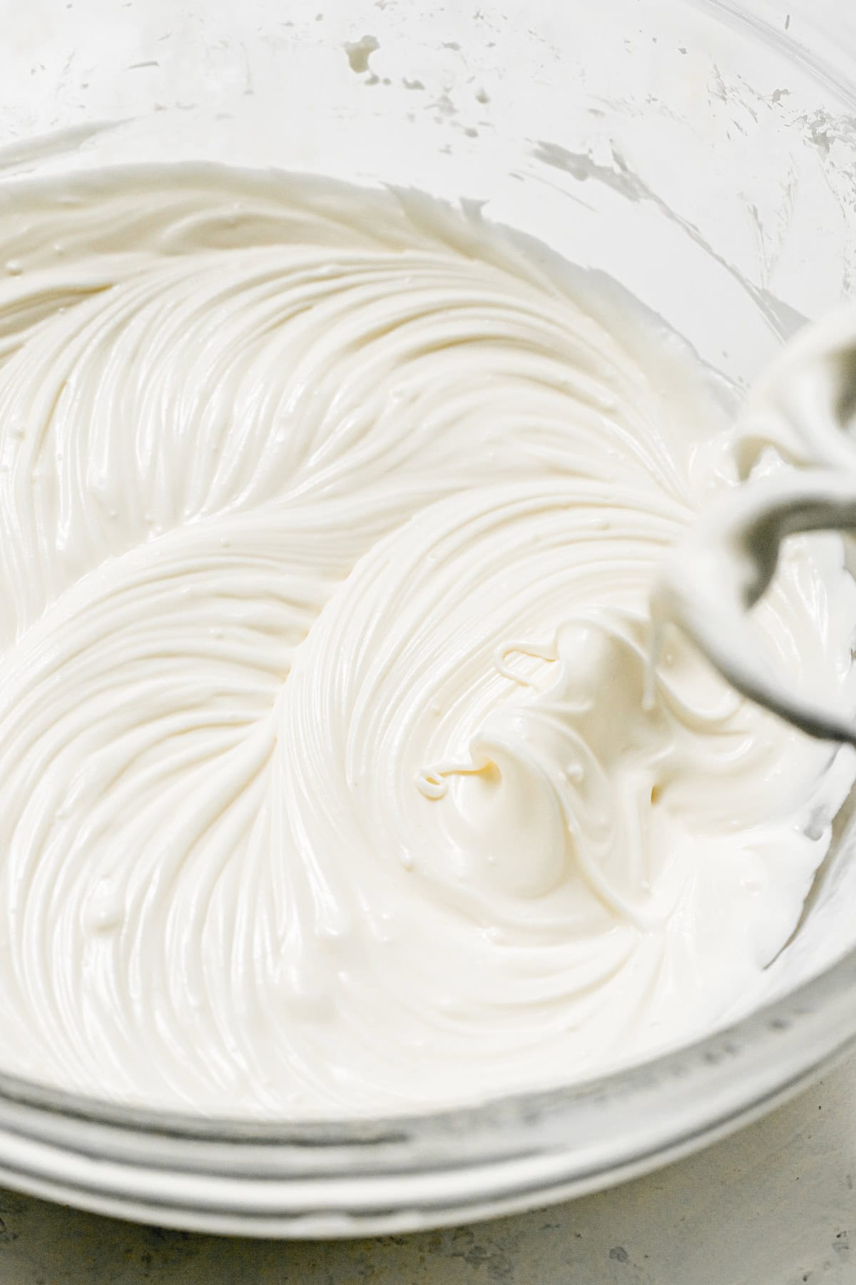 whipped cream cheese frosting in bowl.