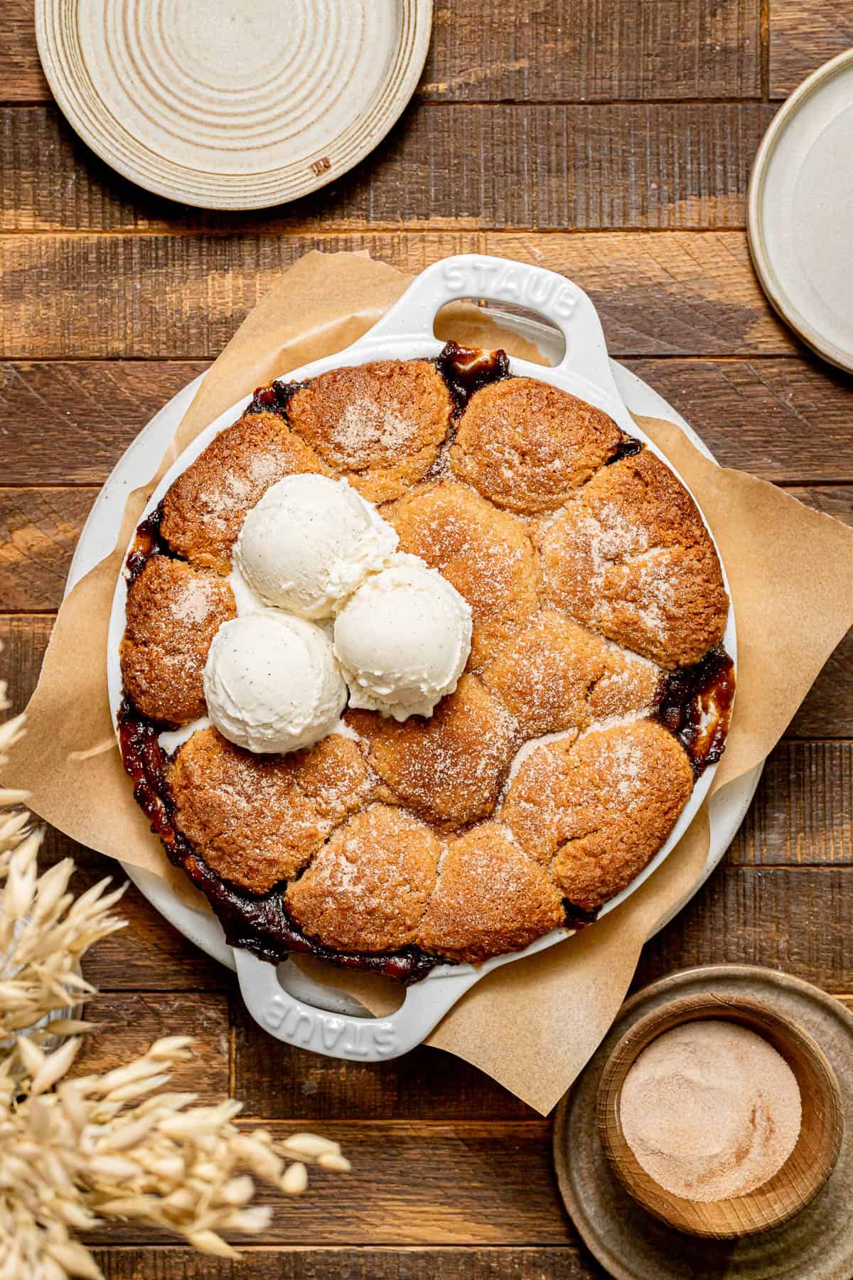 Cinnamon Sugar Apple Cobbler with plates around.