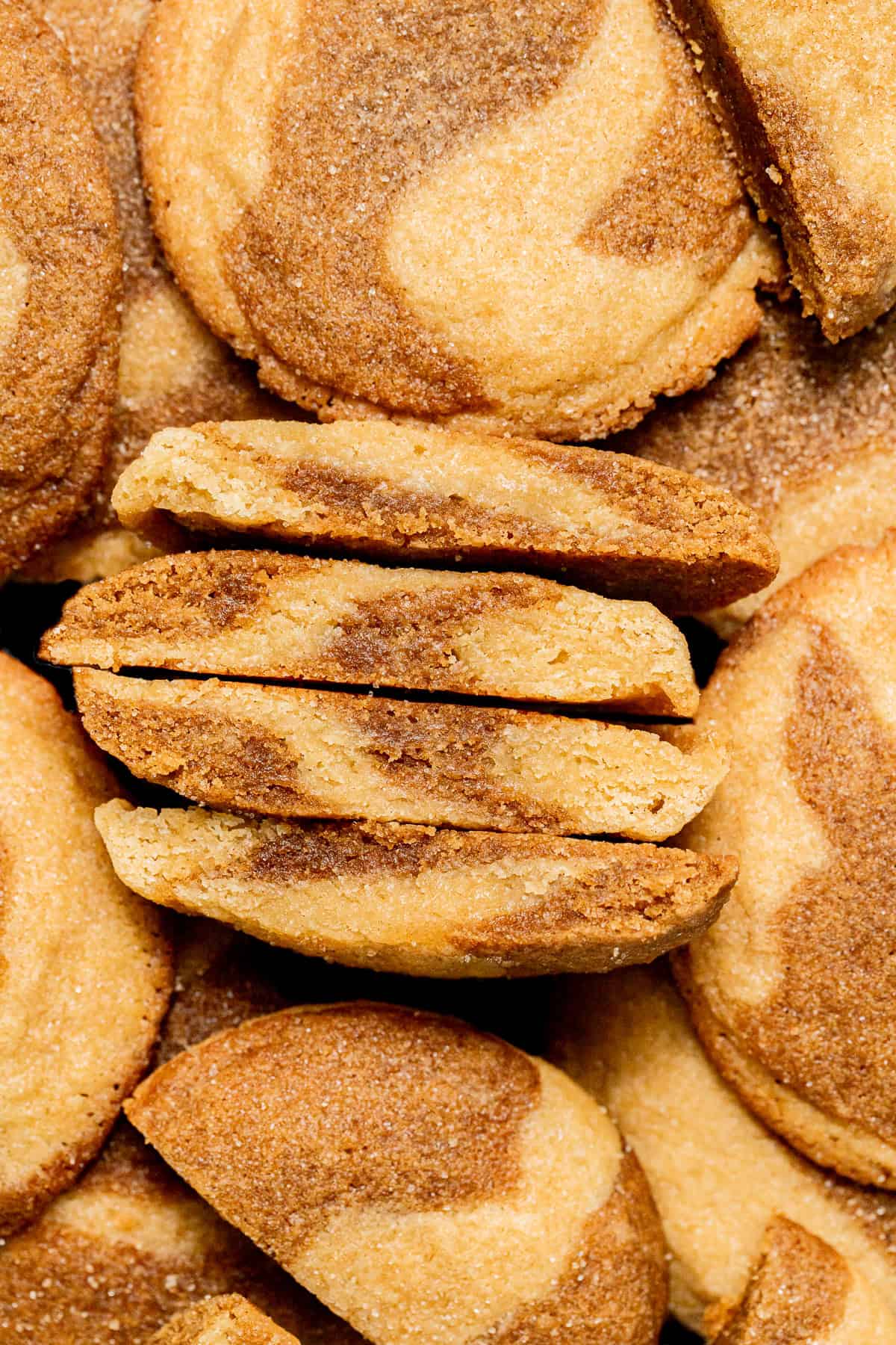 marbled ginger molasses snickerdoodles cut in half to show inside texture.