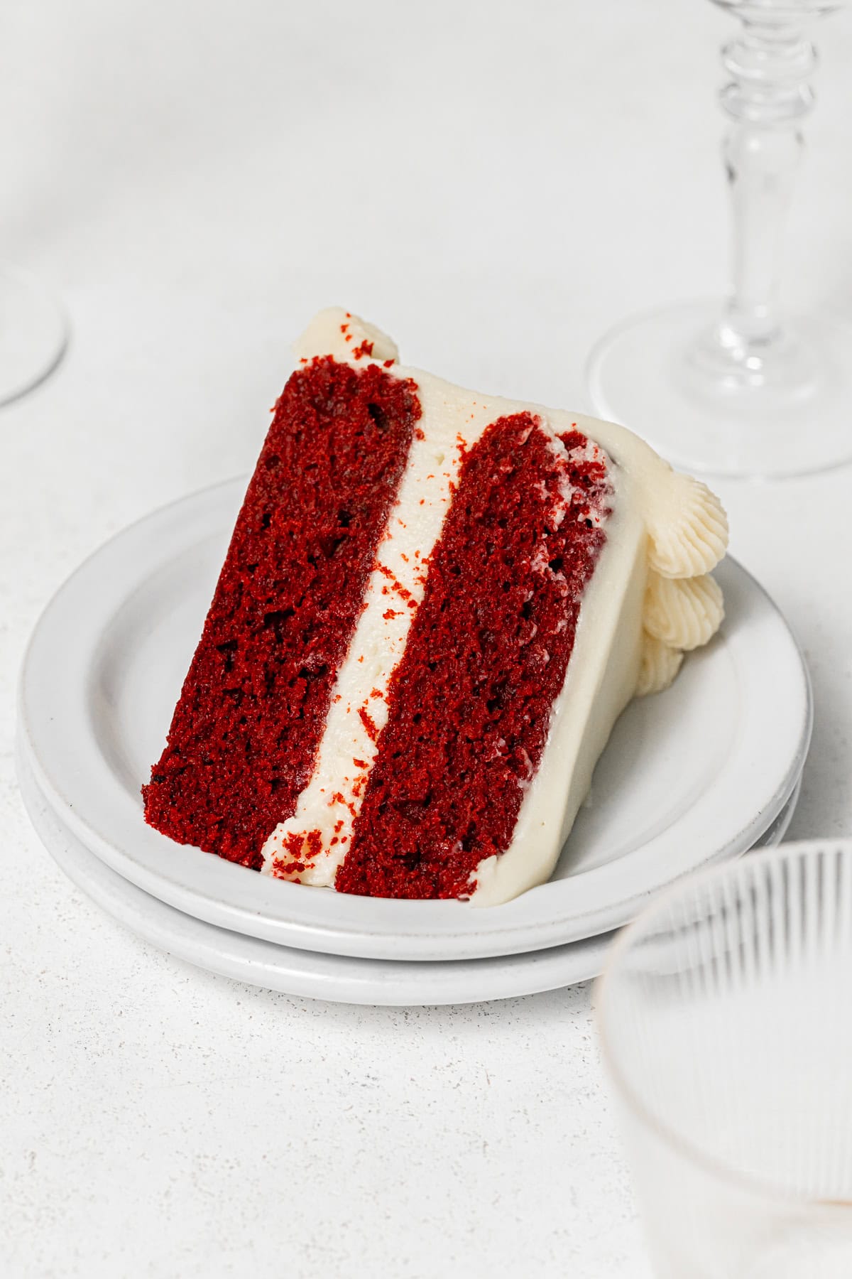 slice of red velvet cake on white plate.