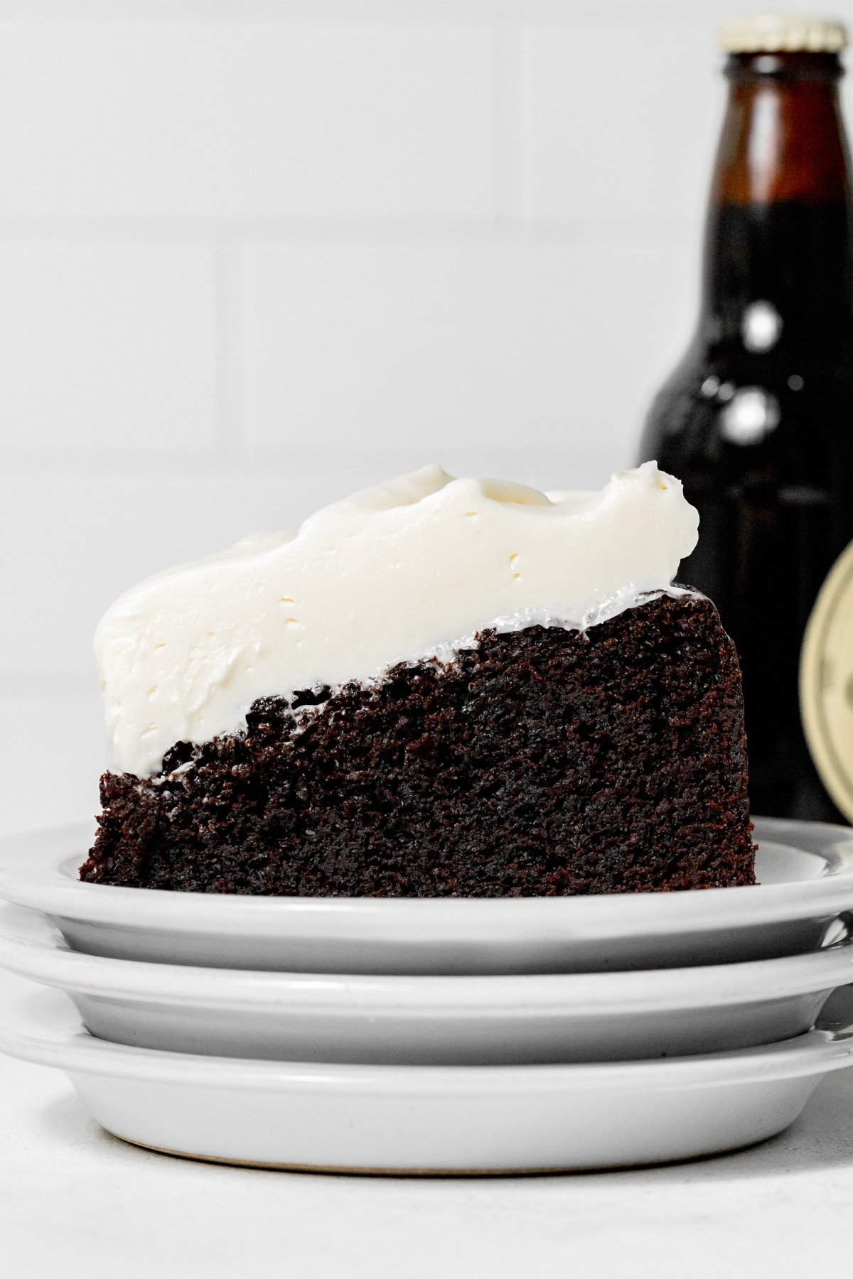 Chocolate Guinness Cake slice on plate.