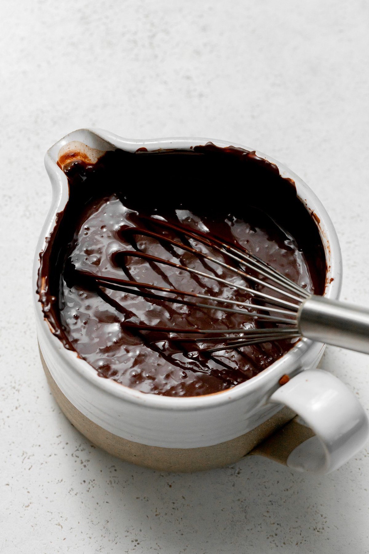 Guinness and cocoa powder in bowl.