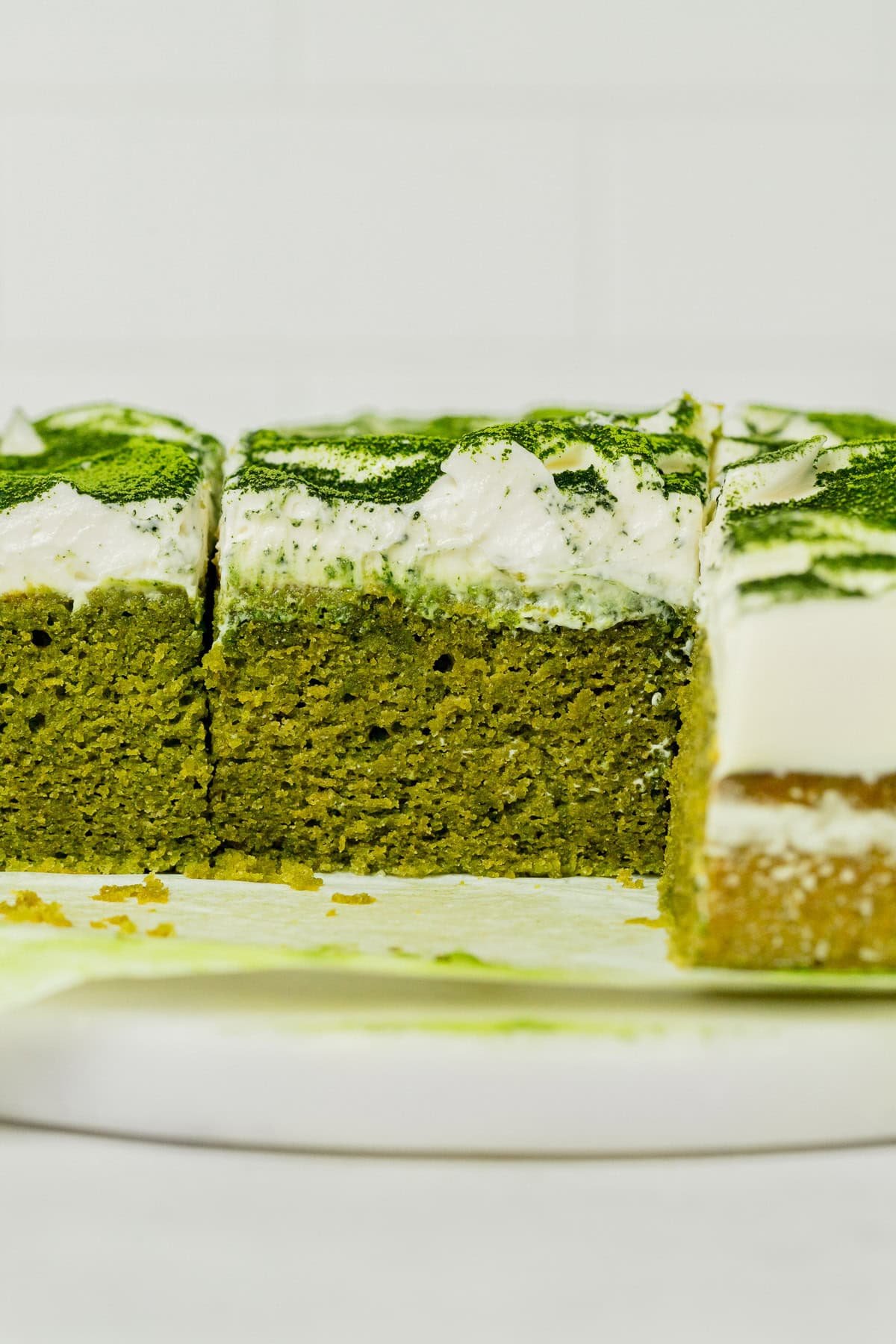 Matcha cake cut to show cross section.