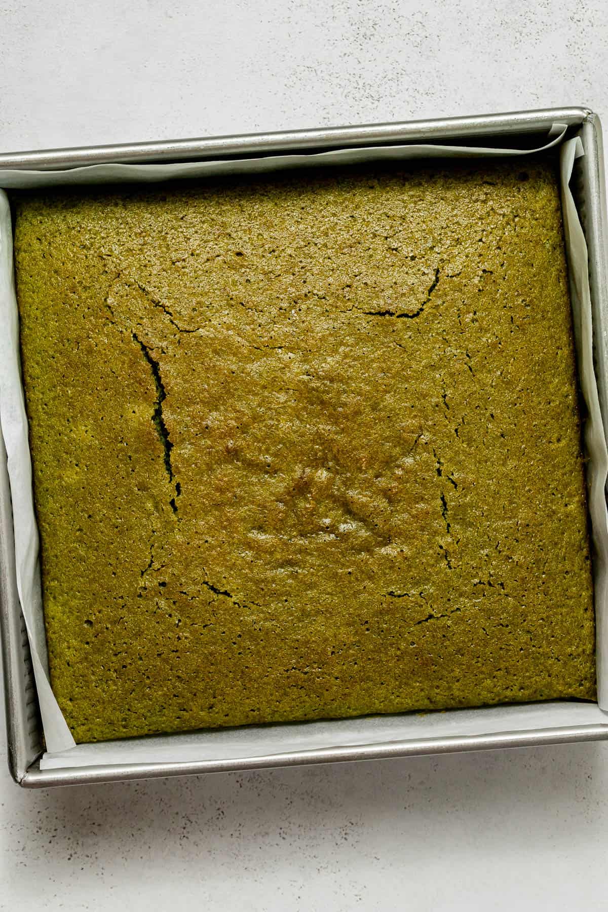 baked matcha cake in pan.