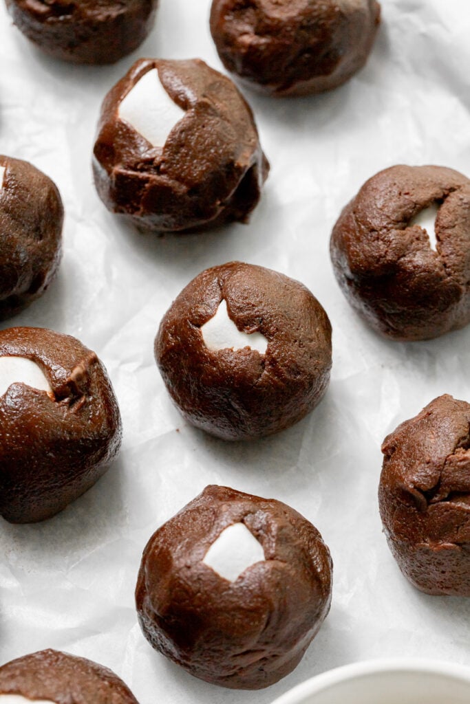 cookie dough balls on baking sheet.