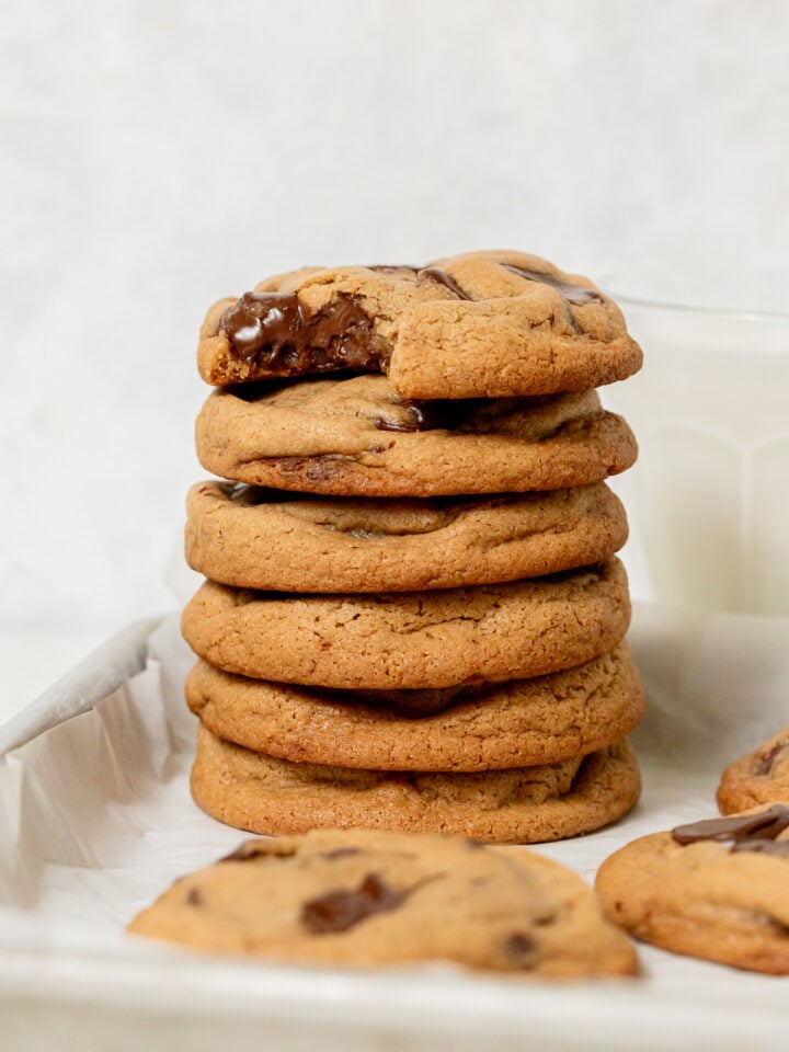 bakery style chocolate chip cookies stacked.