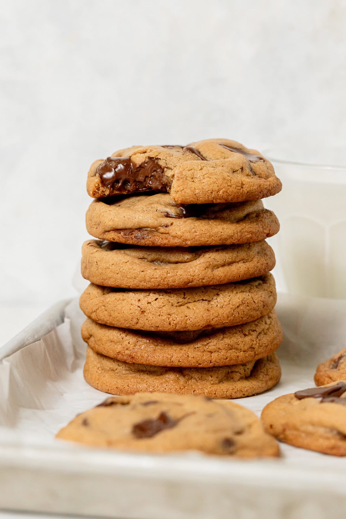bakery style chocolate chip cookies stacked.
