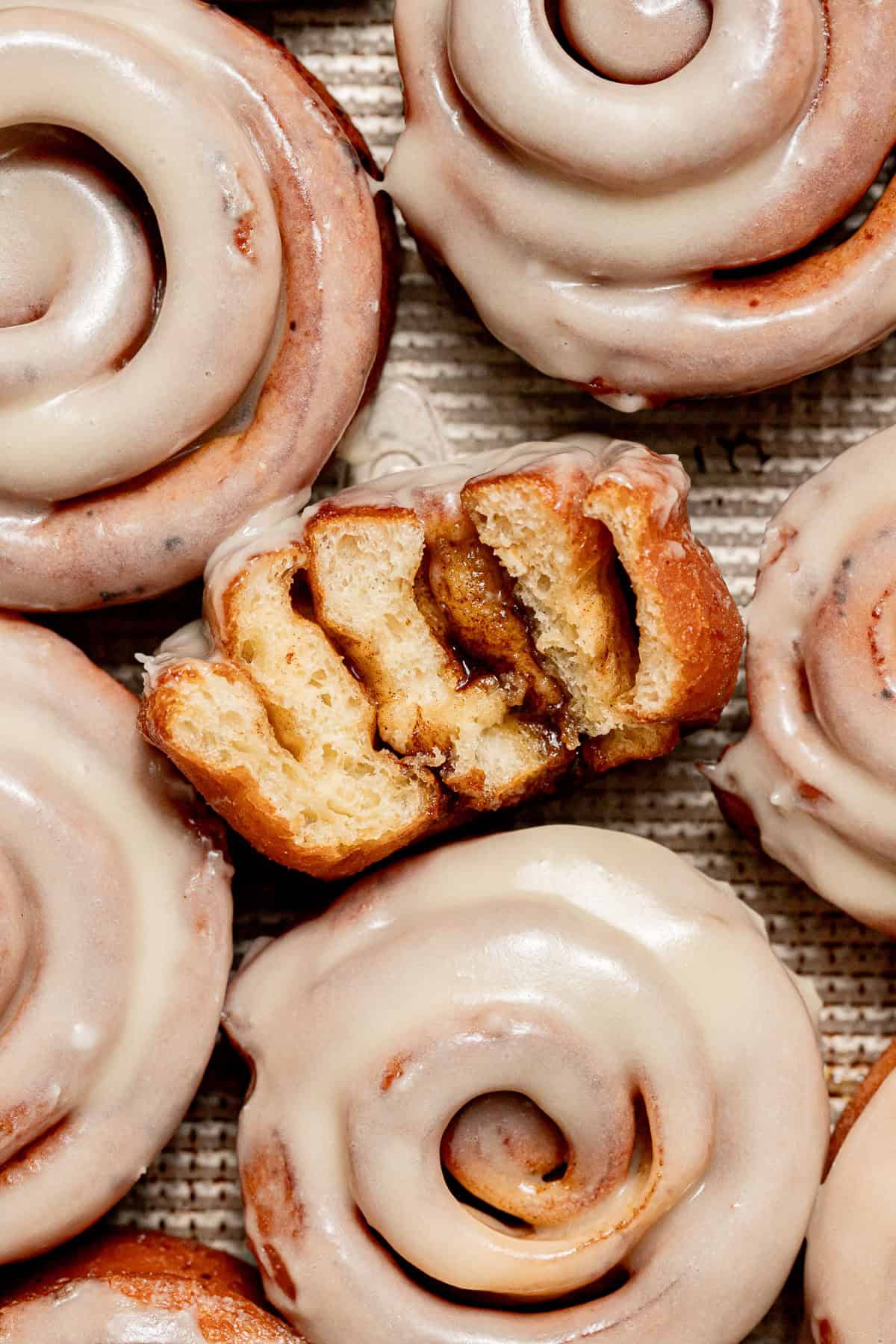 Cinnamon Roll Donut cut to show inside. 