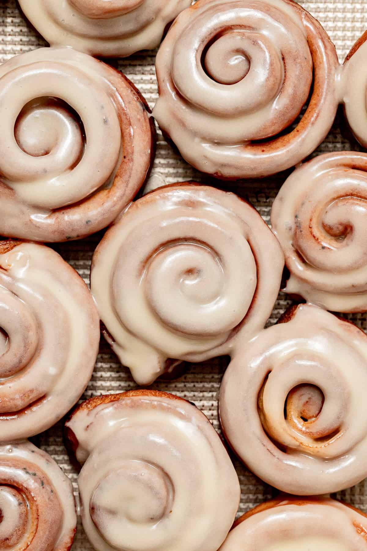 cinnamon roll donuts on baking sheet.