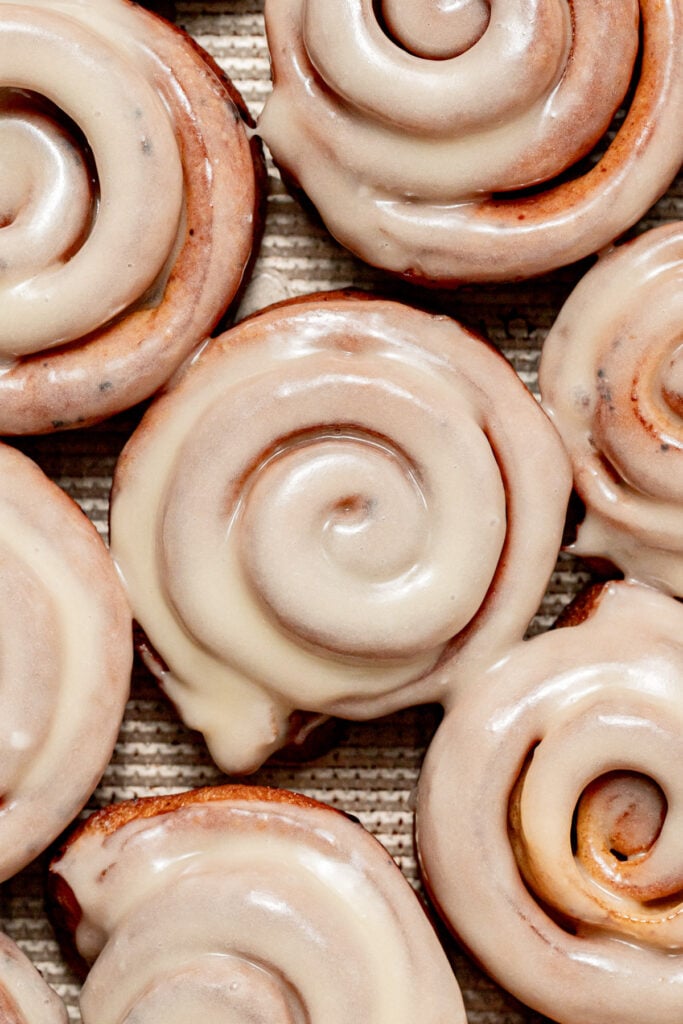 Cinnamon Roll Donuts on baking sheet.