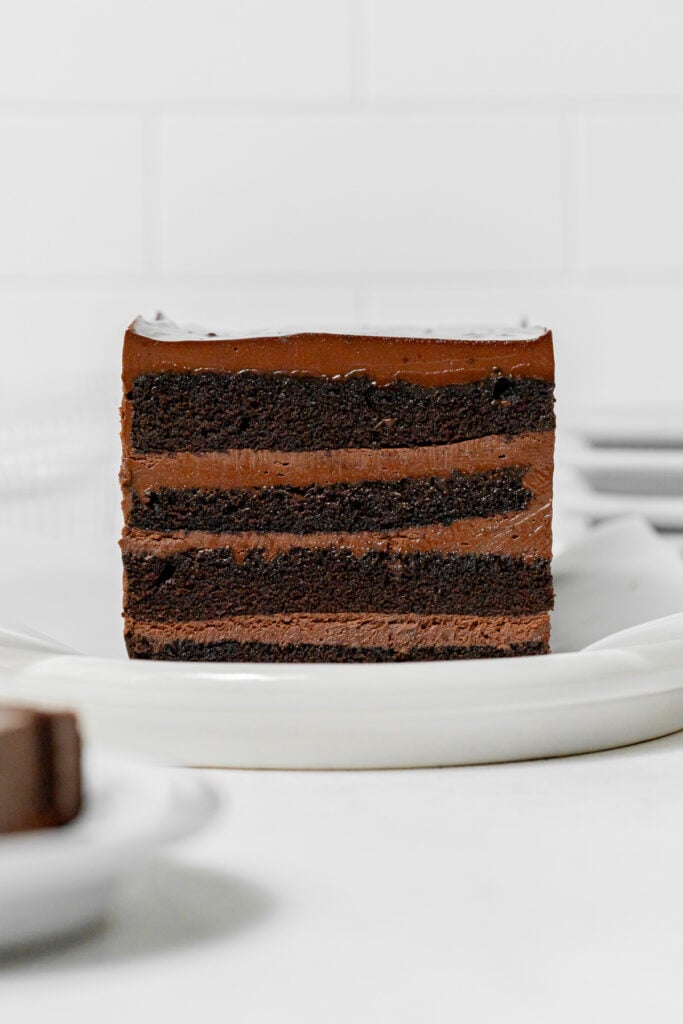 assembled cake on white serving plate.