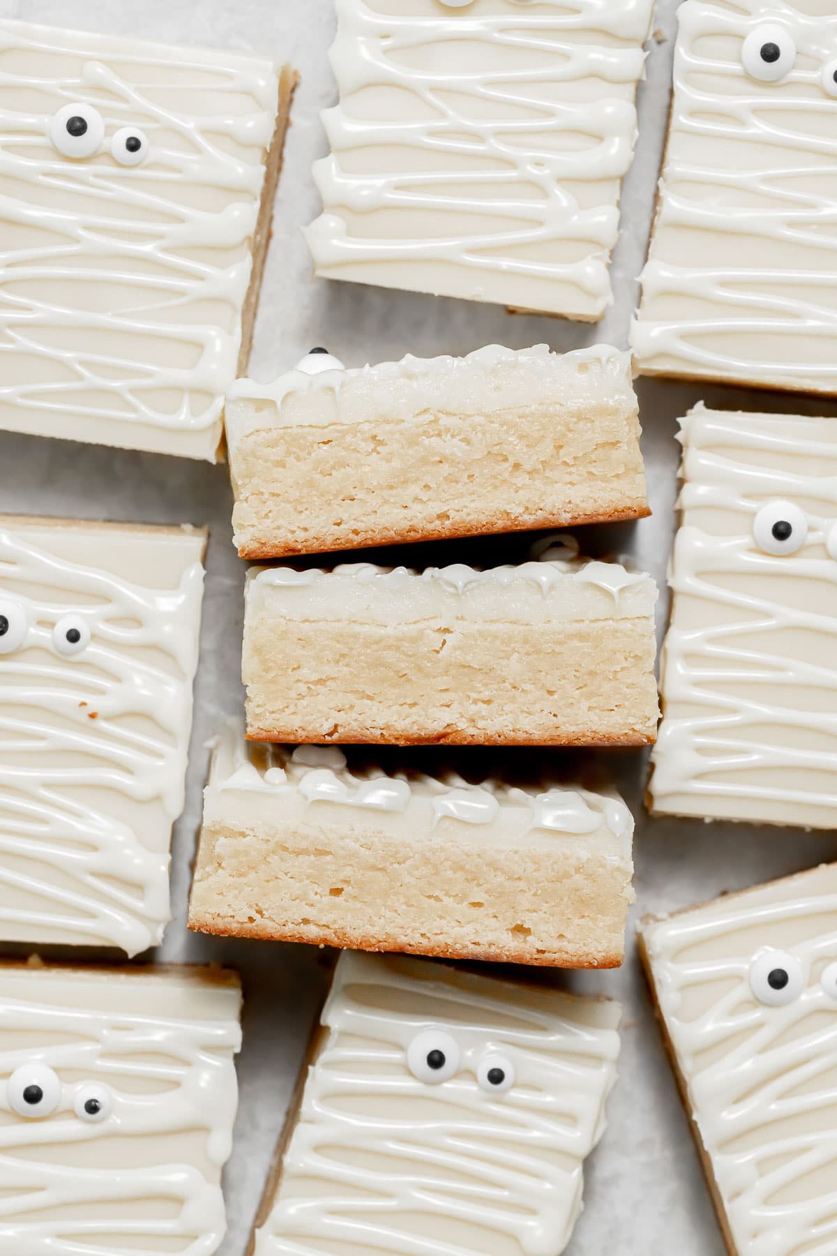 white chocolate brownies lined up on sides.