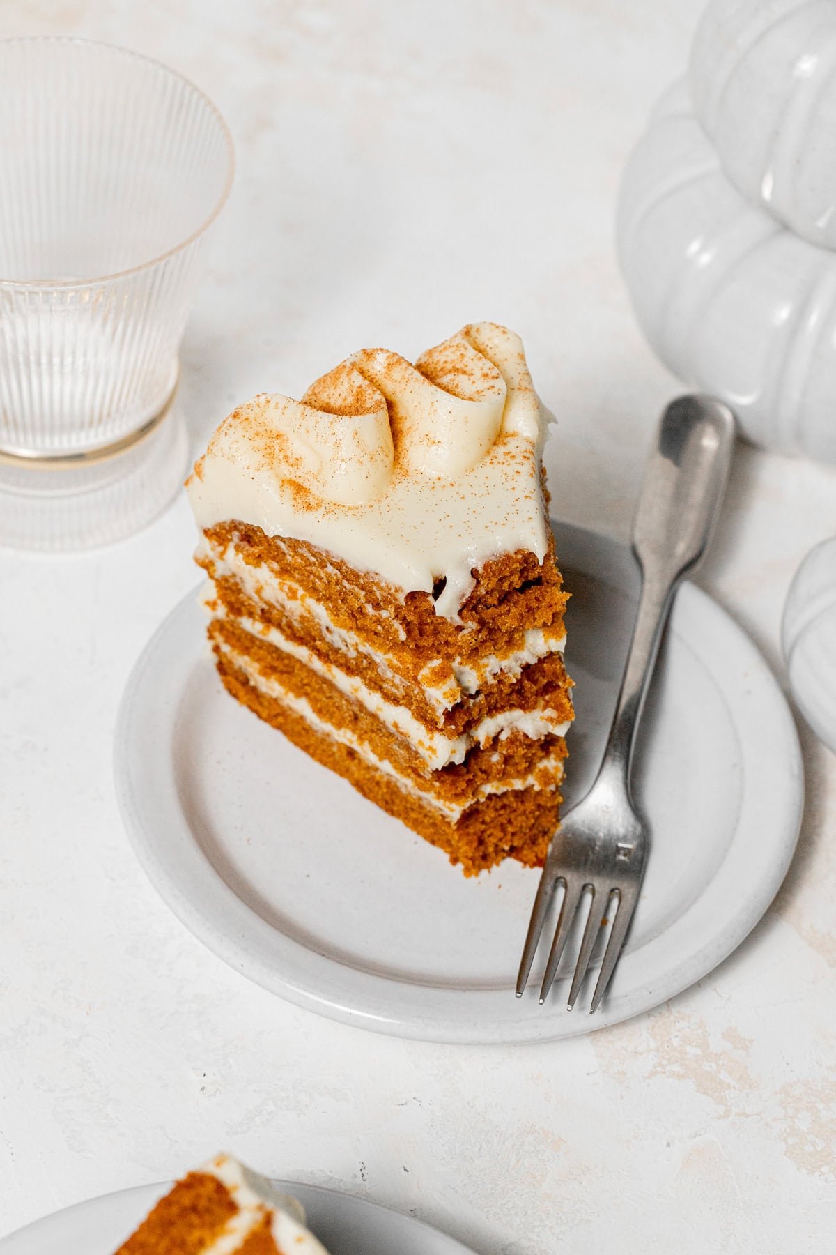 slice of Pumpkin Cake with Cream Cheese Frosting on plate.