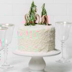 coconut snowball cake on cake stand.